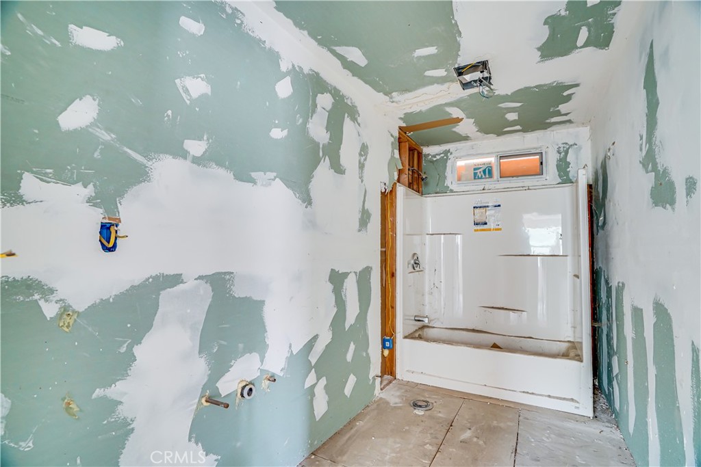 12055 Kagel Canyon Road Sylmar, CA 91342 - Photo 7 of 14 a bathroom with a bathtub and shower