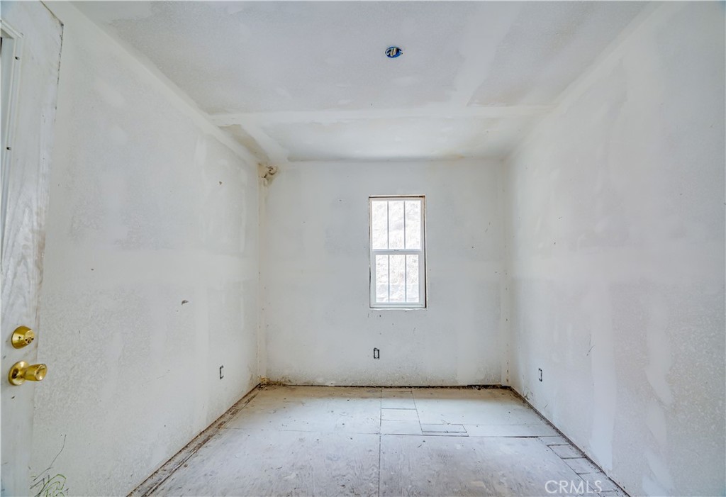12055 Kagel Canyon Road Sylmar, CA 91342 - Photo 9 of 14 a view of an empty room with a window