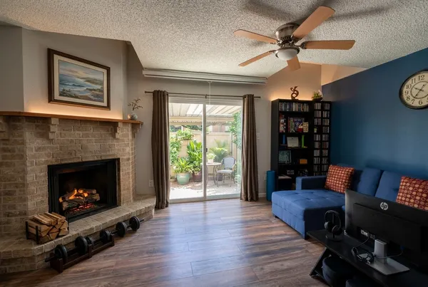 a living room with furniture and a fireplace