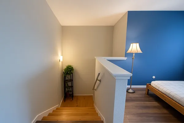 a view of a livingroom with furniture and staircase