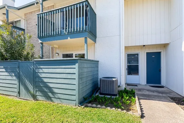 a view of a two chairs in the patio