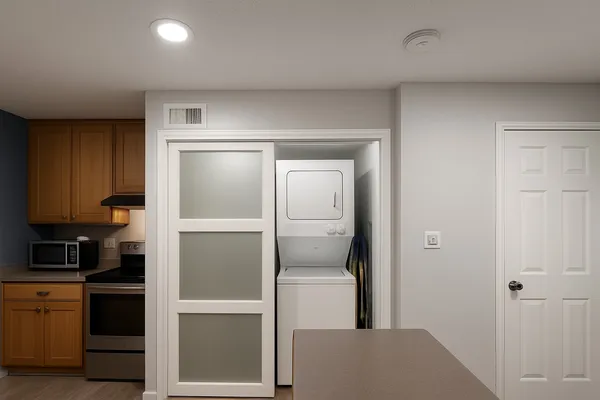 a kitchen with a refrigerator and cabinets