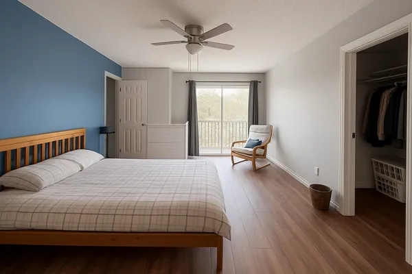 a bedroom with a bed and a chair