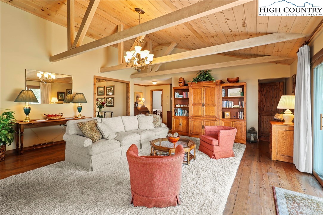 8015 Cloud Forest Lane Blowing Rock, NC 28605 - Photo 7 of 23 a living room with furniture and wooden floor