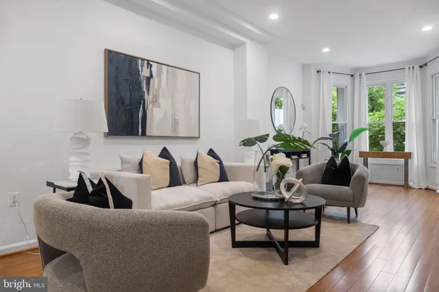 a living room with furniture and a table