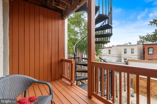 a view of a building with sitting area
