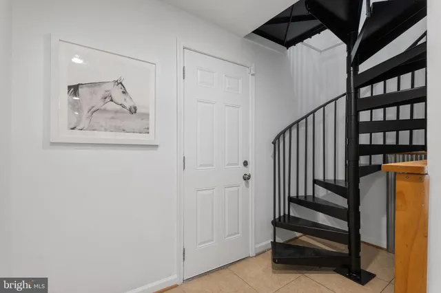 a bedroom with a bed and a lamp on table