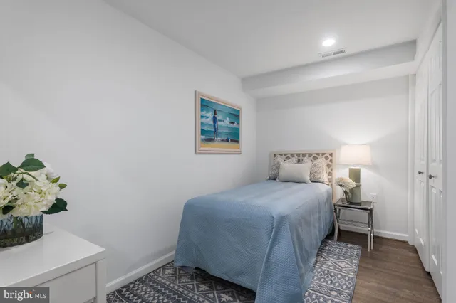 a bedroom with a bed and a table