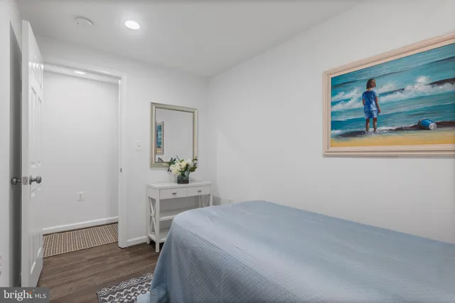 a bedroom with a bed and a dresser