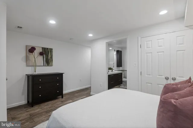 a bathroom with a shower and a mirror