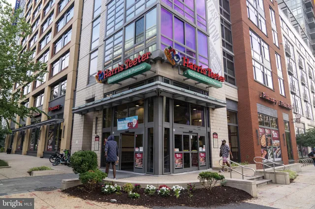 a view of a street with a building in the background