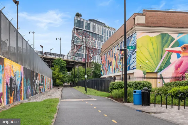 a front view of a building with a yard
