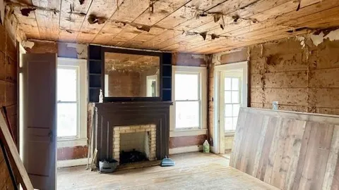a bathroom with a walk in closet and mirror