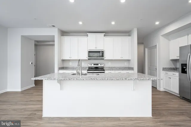 a view of kitchen with wooden floor