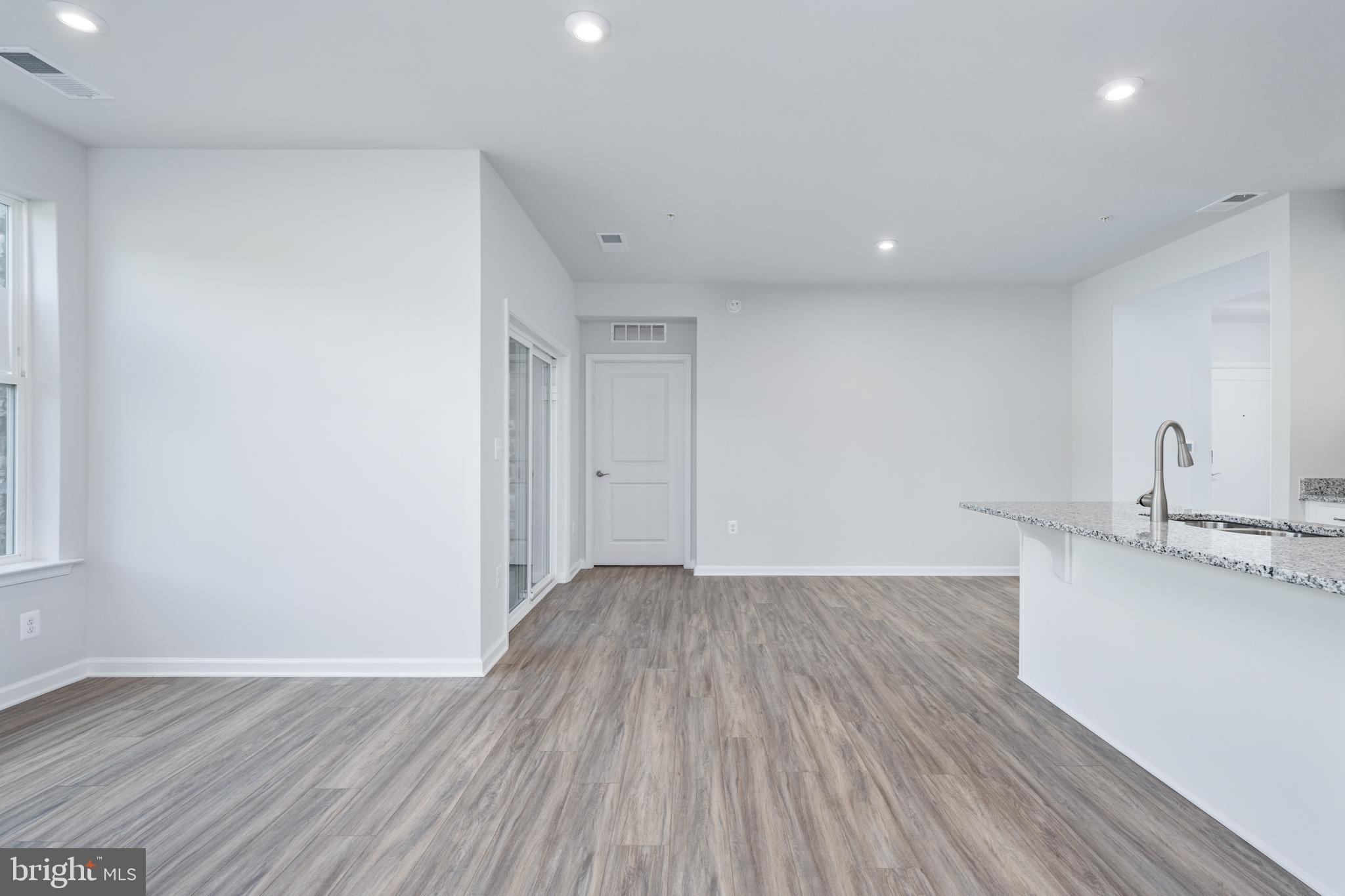 29 Hyssop Way, Unit 103 Stafford, VA 22554 - Photo 19 of 39 a view of a room with wooden floor and sink