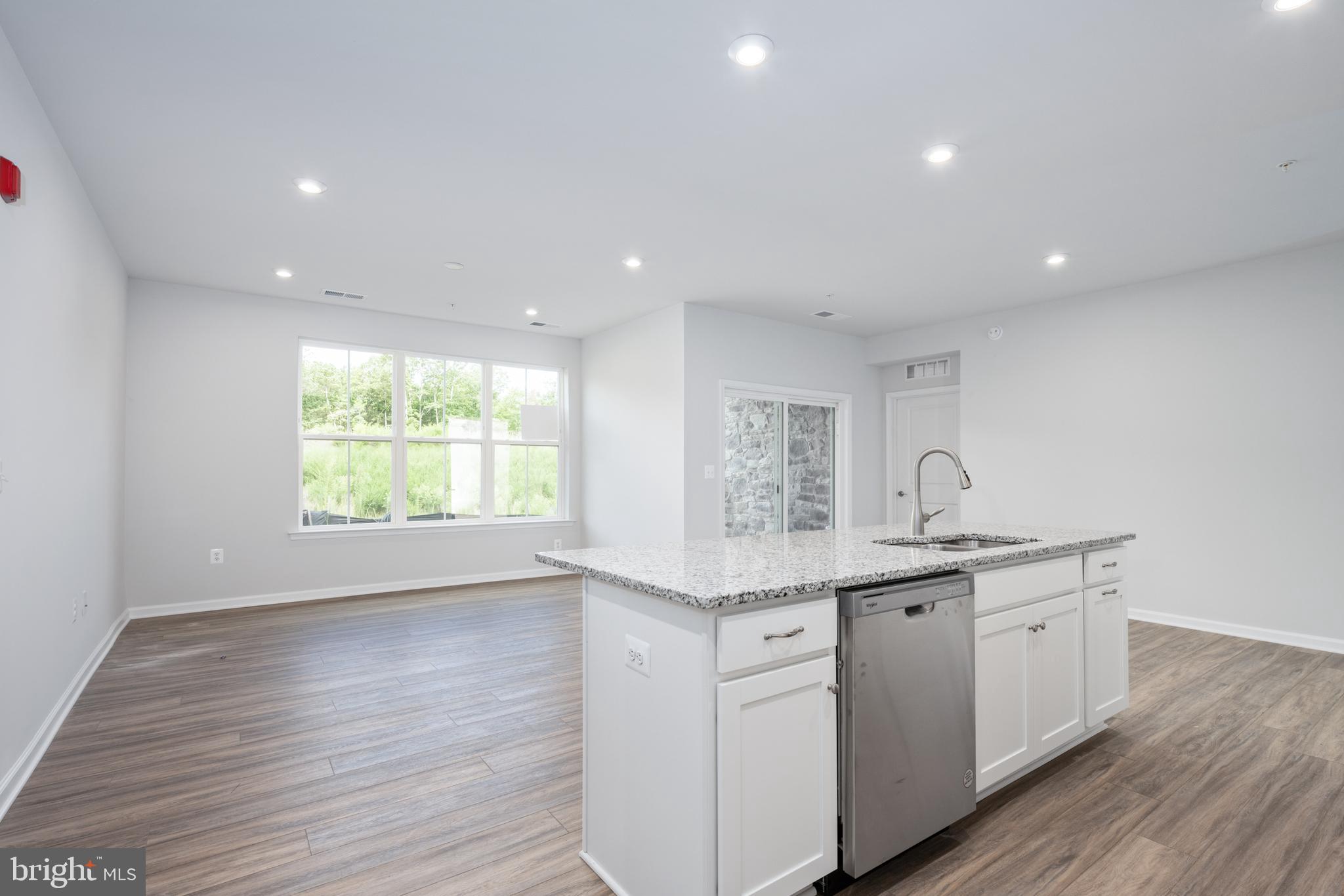 29 Hyssop Way, Unit 103 Stafford, VA 22554 - Photo 21 of 39 a kitchen with a sink and wooden floor
