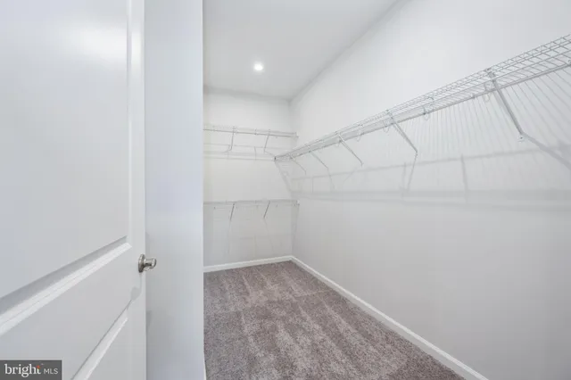 a spacious bathroom with a shower sink and mirror
