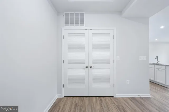 a view of an entryway with wooden floor