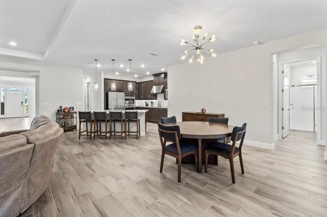 a bathroom with a granite countertop sink toilet a mirror and shower
