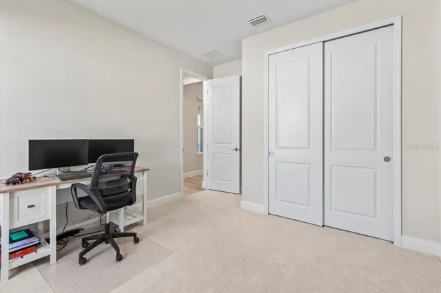 a view of a house with backyard and porch