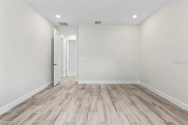 a living room with lots of furniture and gym equipment