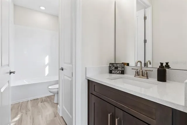 a big yard with lots of green space and trees