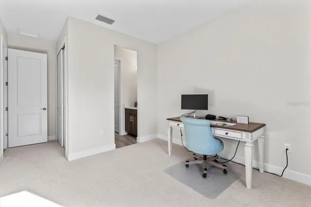 a view of a yard with potted plants