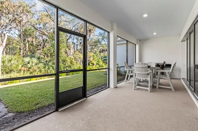 a view of a house with garden and trees
