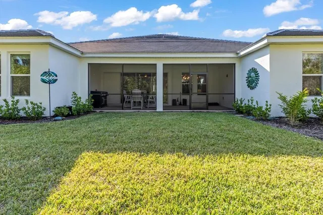 a front view of house with swimming pool having outdoor seating