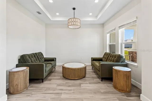 a kitchen with stainless steel appliances kitchen island granite countertop a refrigerator stove and sink