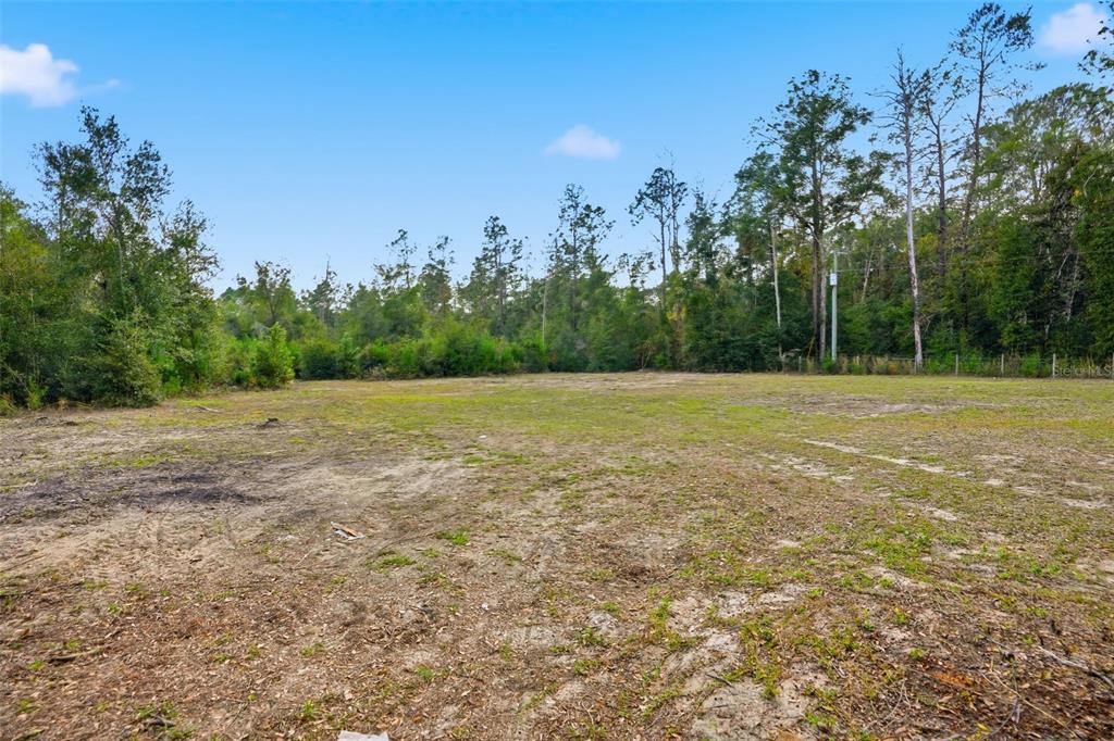 27080 Hiawatha Boulevard Brooksville, FL 34601 - Photo 32 of 39 a view of a field with trees in background