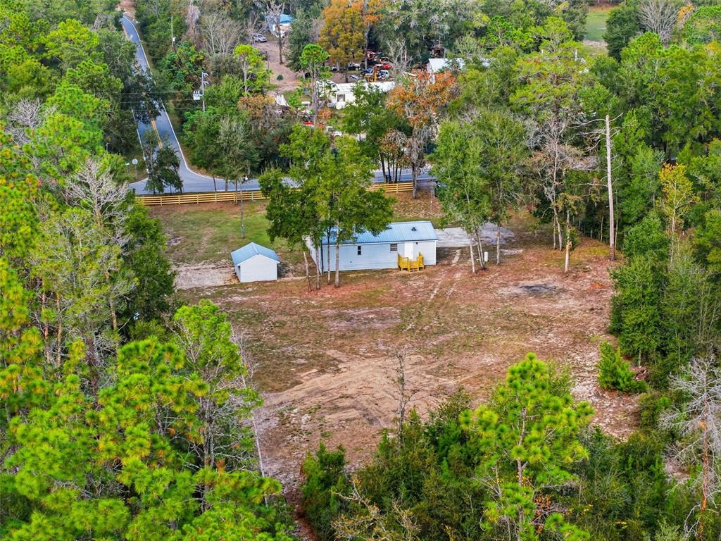 27080 Hiawatha Boulevard Brooksville, FL 34601 - Photo 36 of 39 a view of a yard with plants and a fountain
