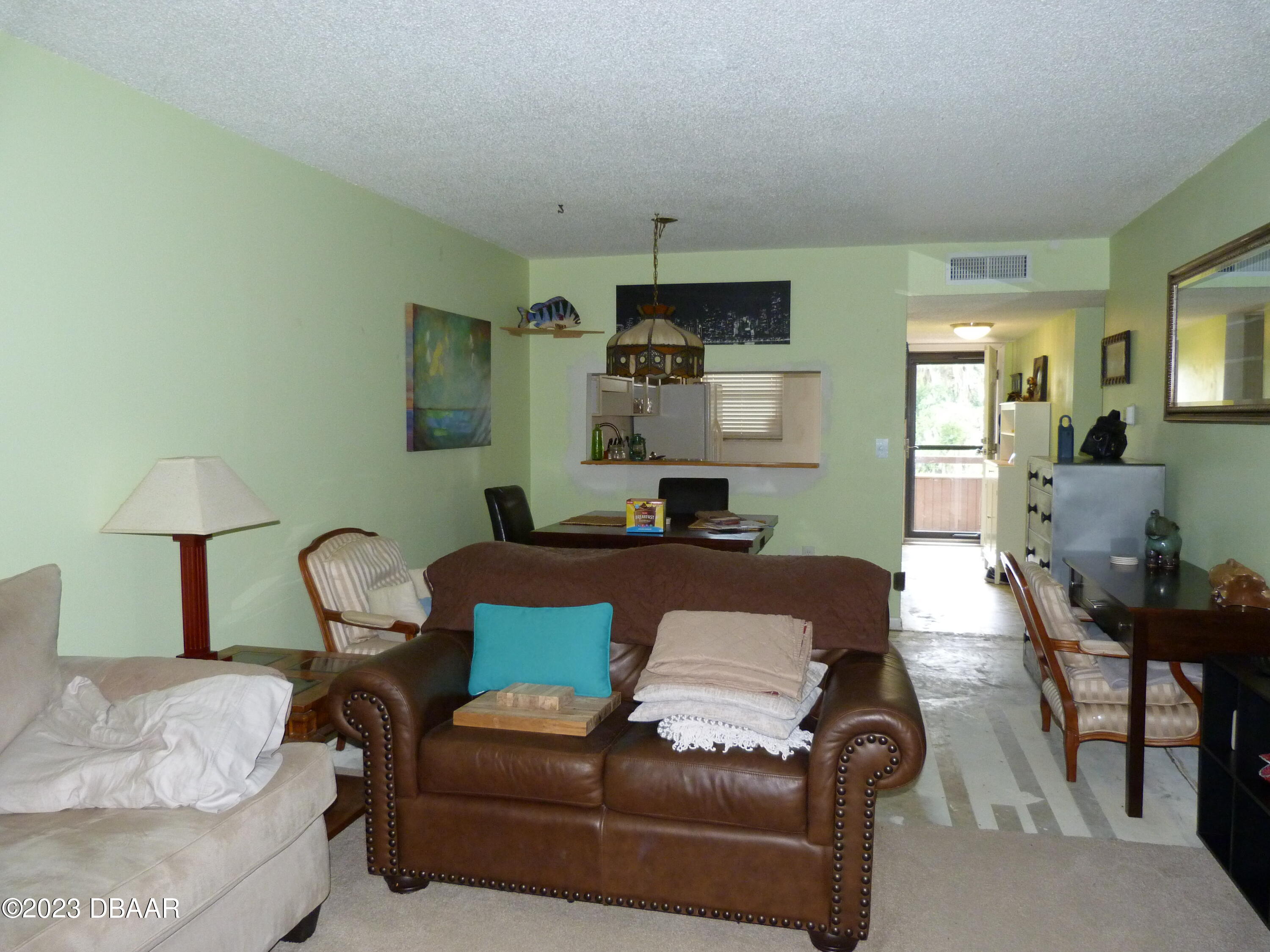 640 North Nova Road, Unit 303 Ormond Beach, FL 32174 - Photo 16 of 31 a living room with furniture