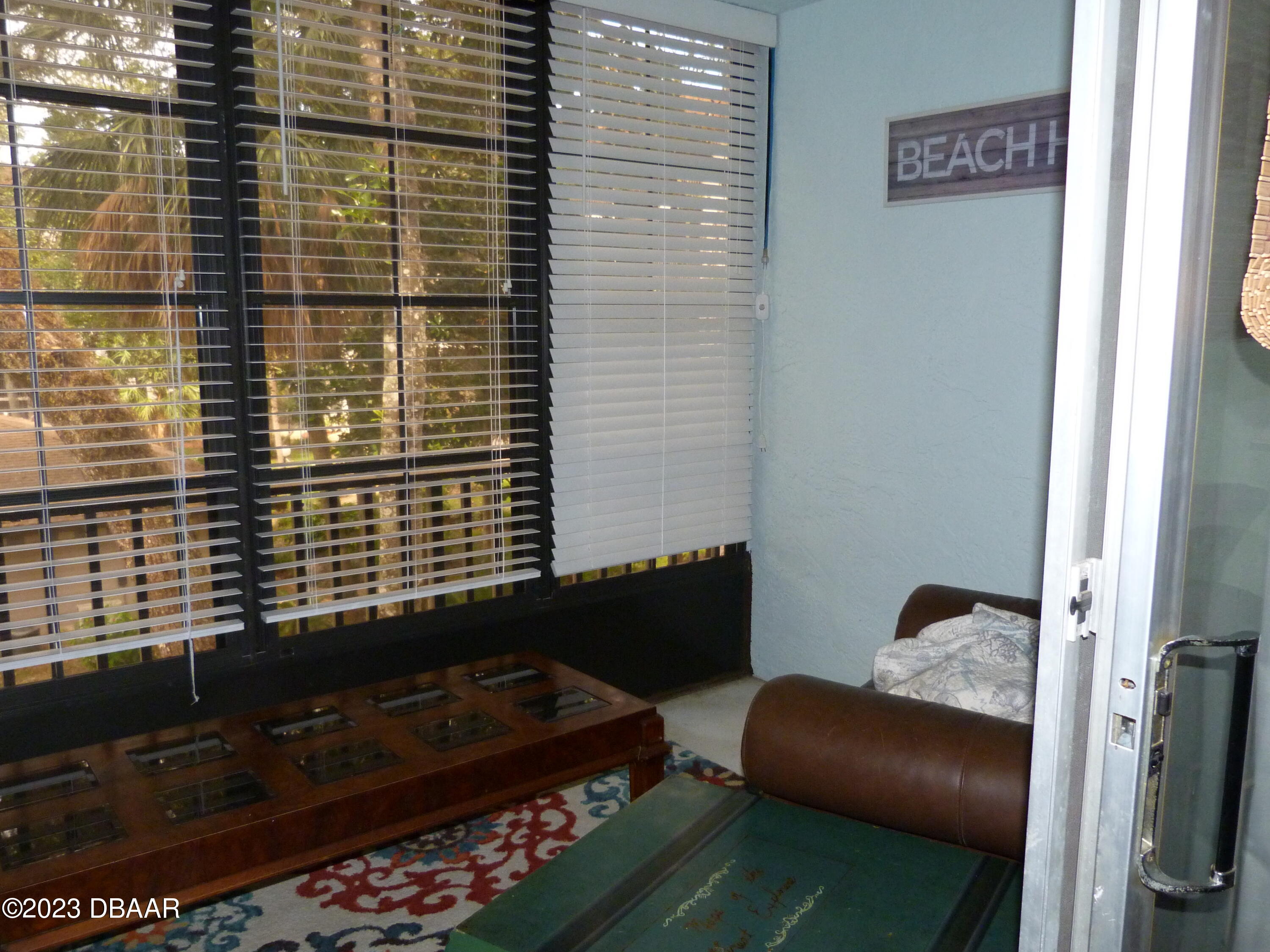 640 North Nova Road, Unit 303 Ormond Beach, FL 32174 - Photo 18 of 31 a bedroom with a bed and a window
