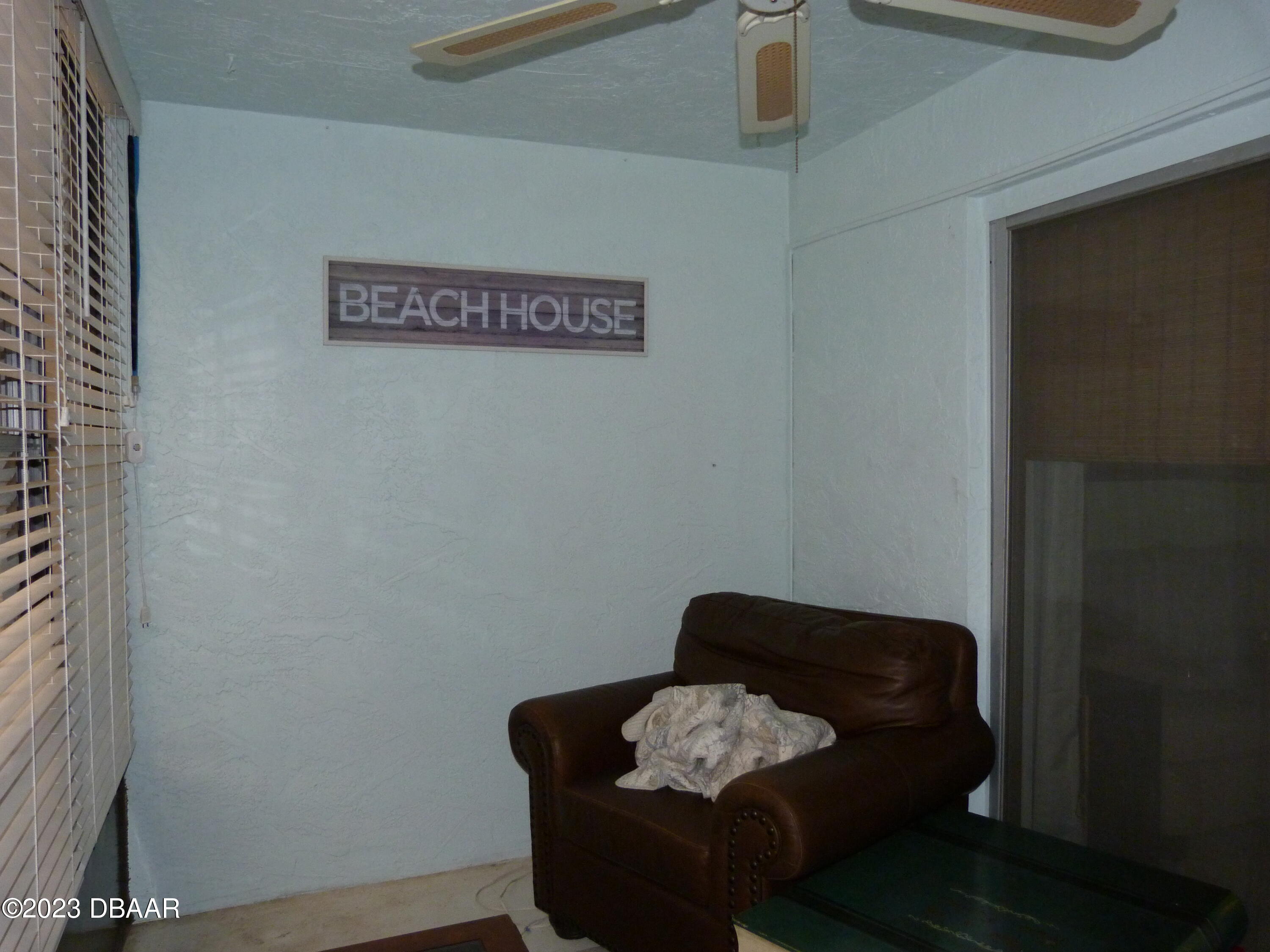 640 North Nova Road, Unit 303 Ormond Beach, FL 32174 - Photo 20 of 31 a living room with furniture and wooden floor