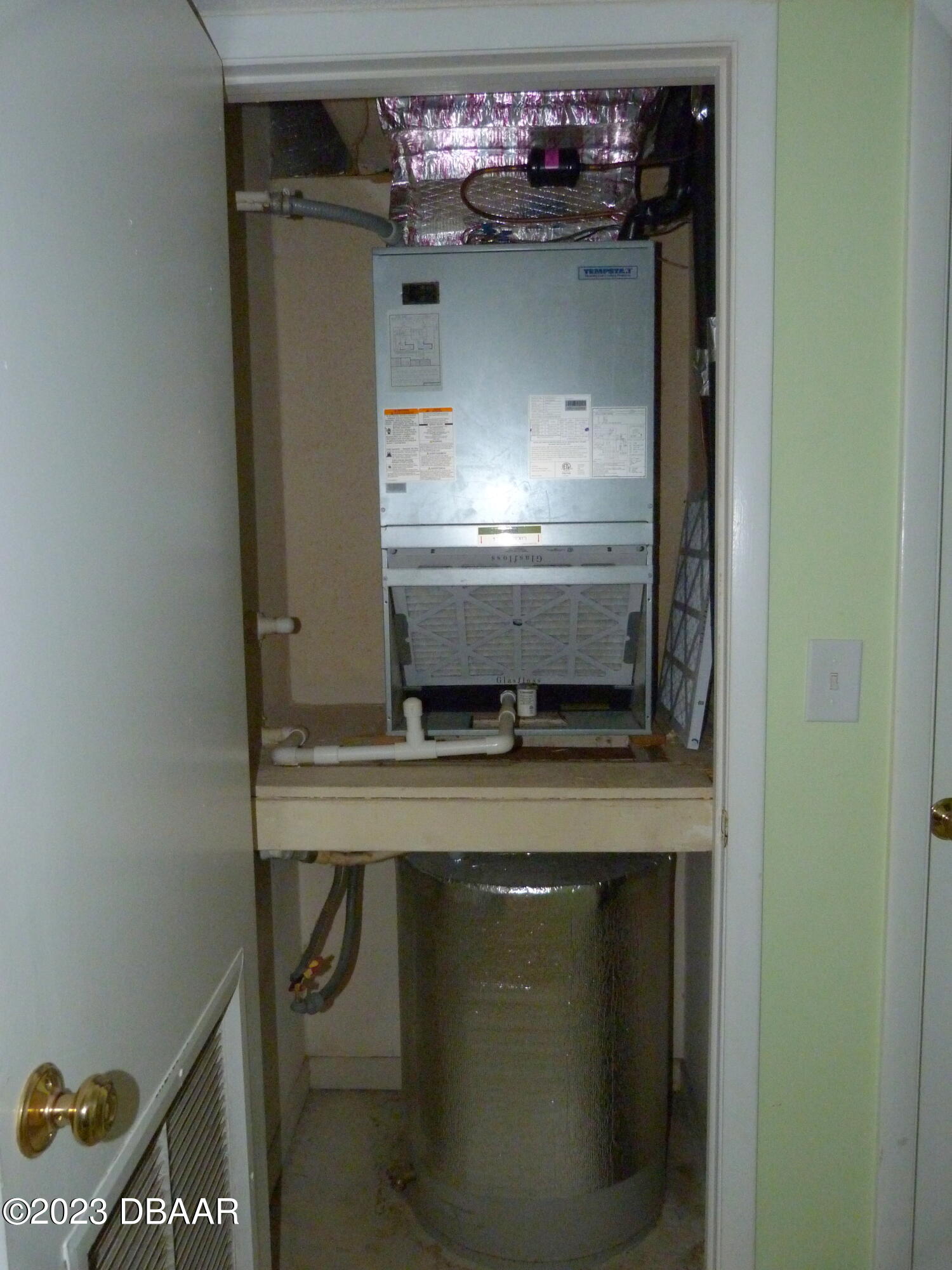 640 North Nova Road, Unit 303 Ormond Beach, FL 32174 - Photo 25 of 31 a room with a stove and a refrigerator