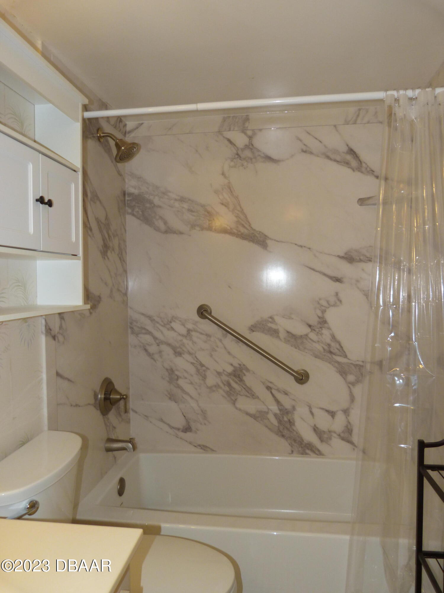 640 North Nova Road, Unit 303 Ormond Beach, FL 32174 - Photo 27 of 31 a bathroom with a shower and a toilet