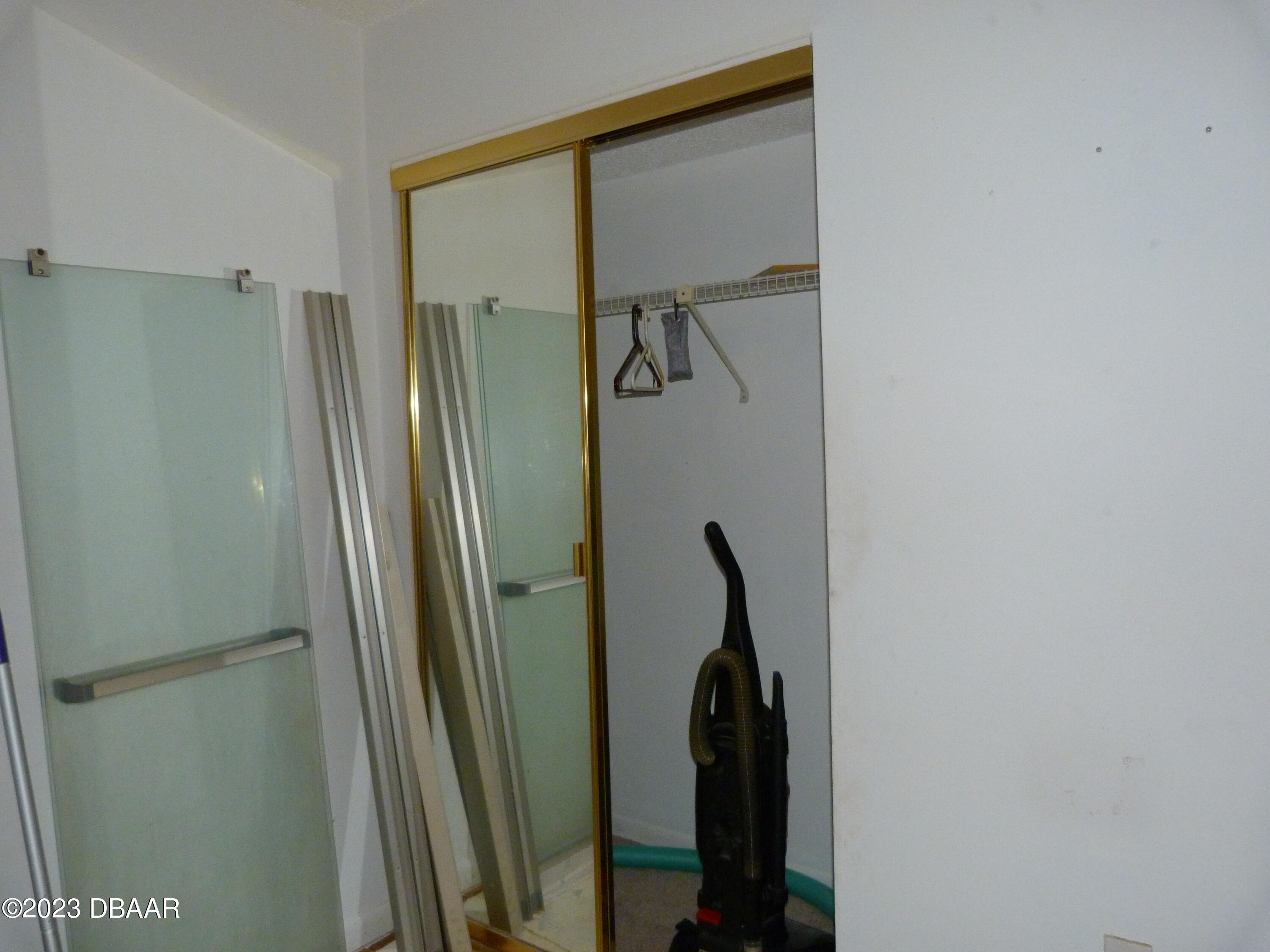 640 North Nova Road, Unit 303 Ormond Beach, FL 32174 - Photo 30 of 31 a bathroom with a shower and a glass door