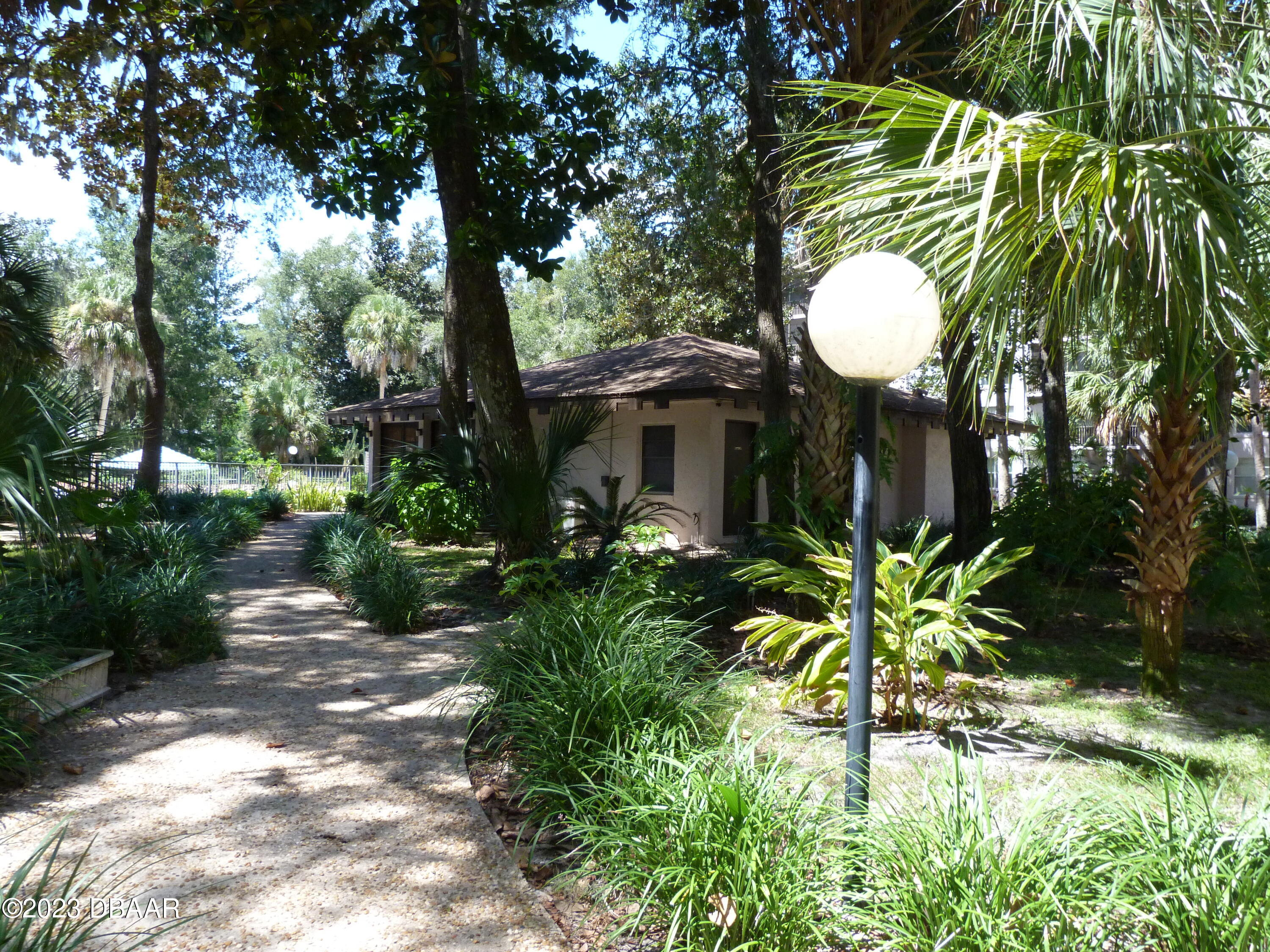 640 North Nova Road, Unit 303 Ormond Beach, FL 32174 - Photo 3 of 31 a view of outdoor space and garden
