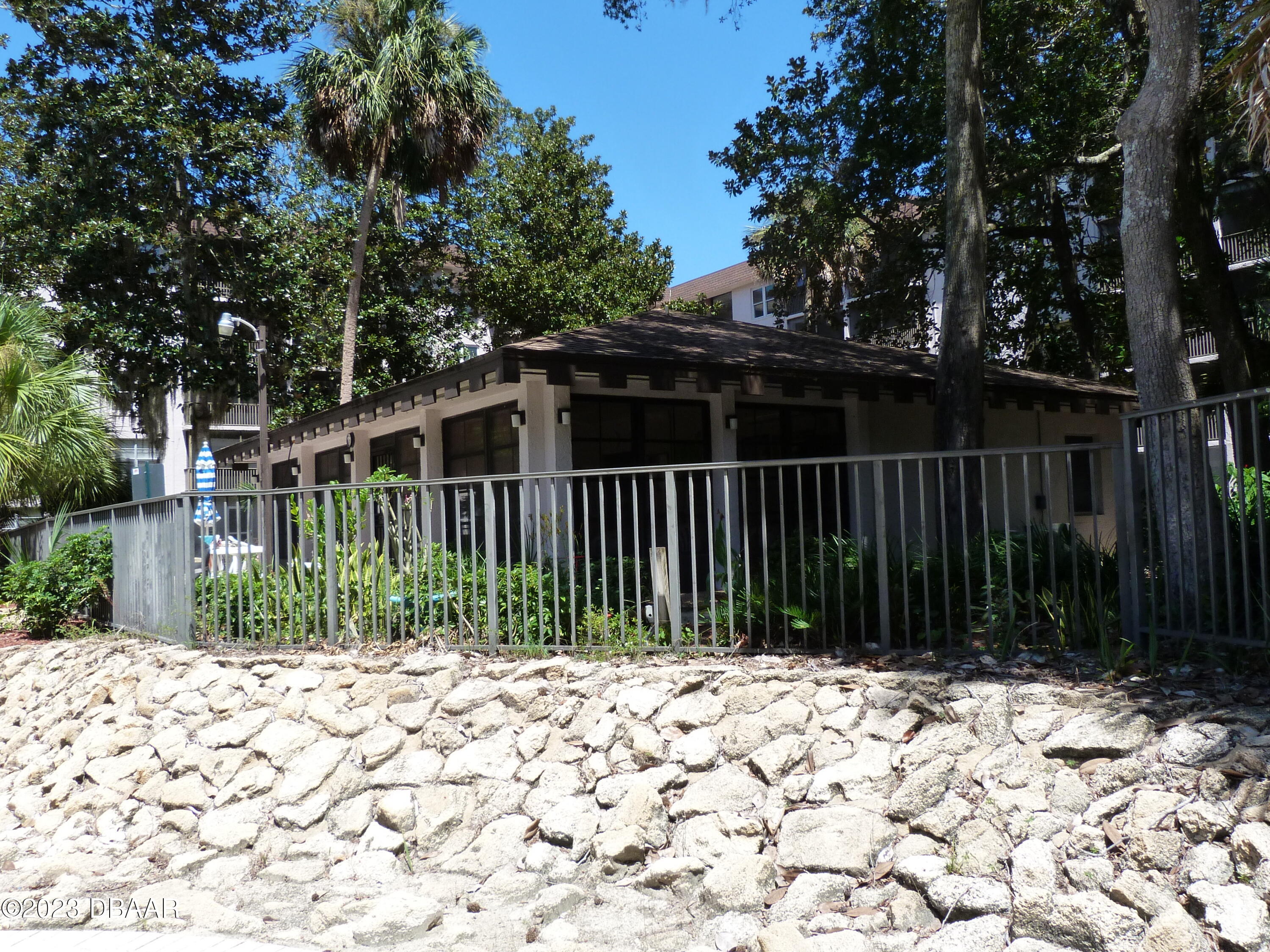 640 North Nova Road, Unit 303 Ormond Beach, FL 32174 - Photo 31 of 31 a view of a house with a small yard