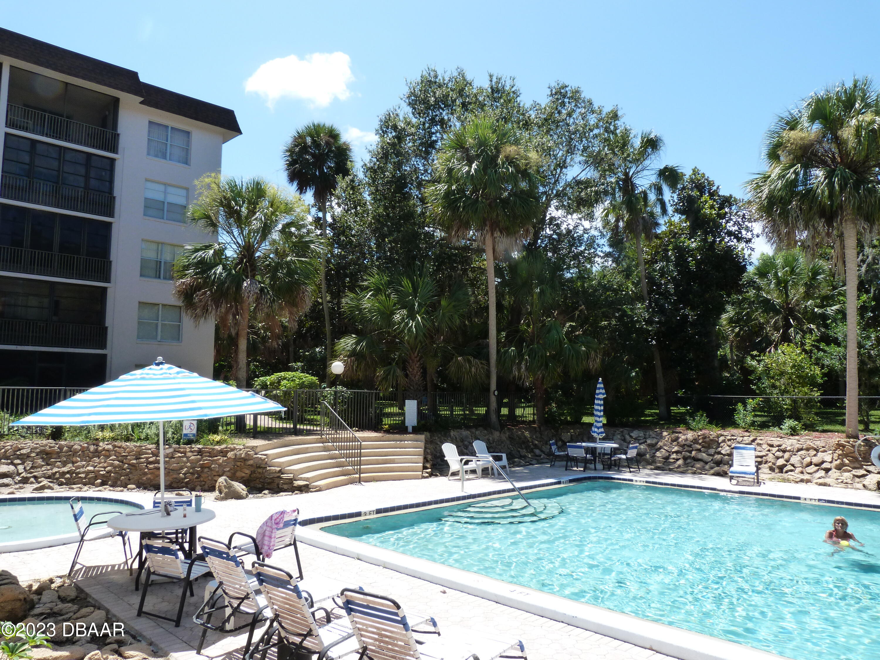 640 North Nova Road, Unit 303 Ormond Beach, FL 32174 - Photo 6 of 31 a view of backyard with a patio and outdoor seating