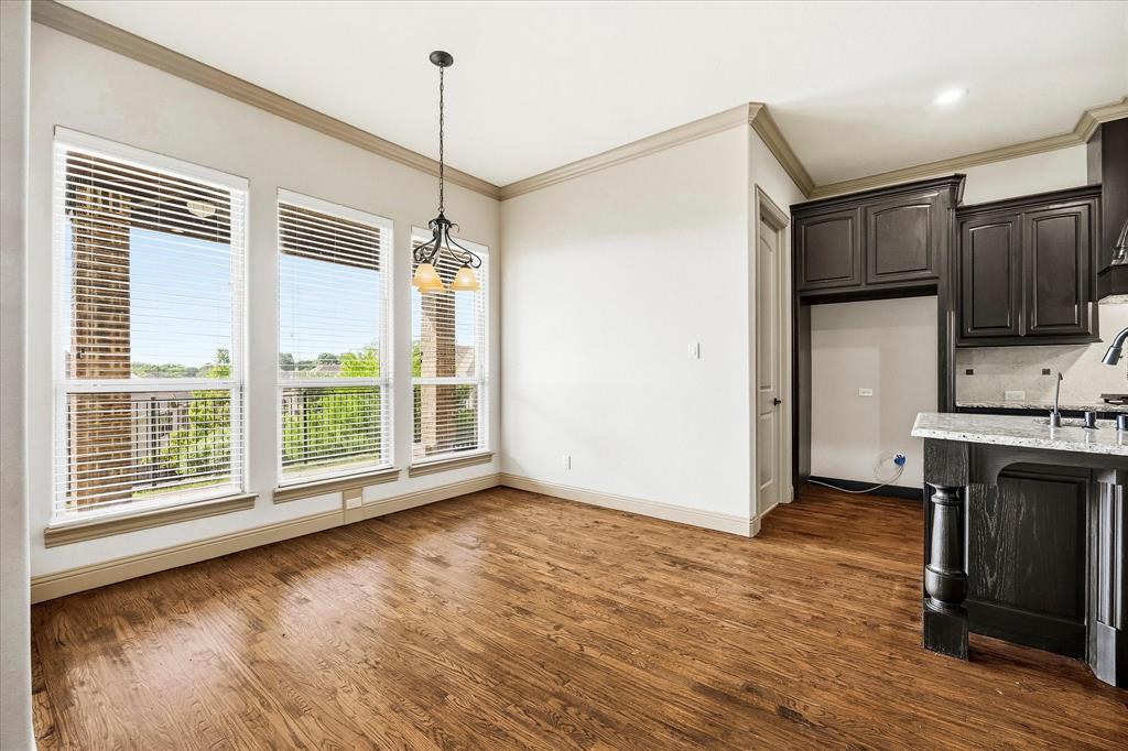 647 Gillon Way Rockwall, TX 75087 - Photo 19 of 40 Breakfast area includes banks of windows for ample natural lighting