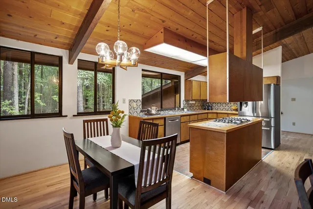 a kitchen with a stove and a refrigerator