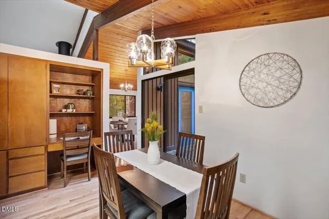 a kitchen with a sink window and cabinets