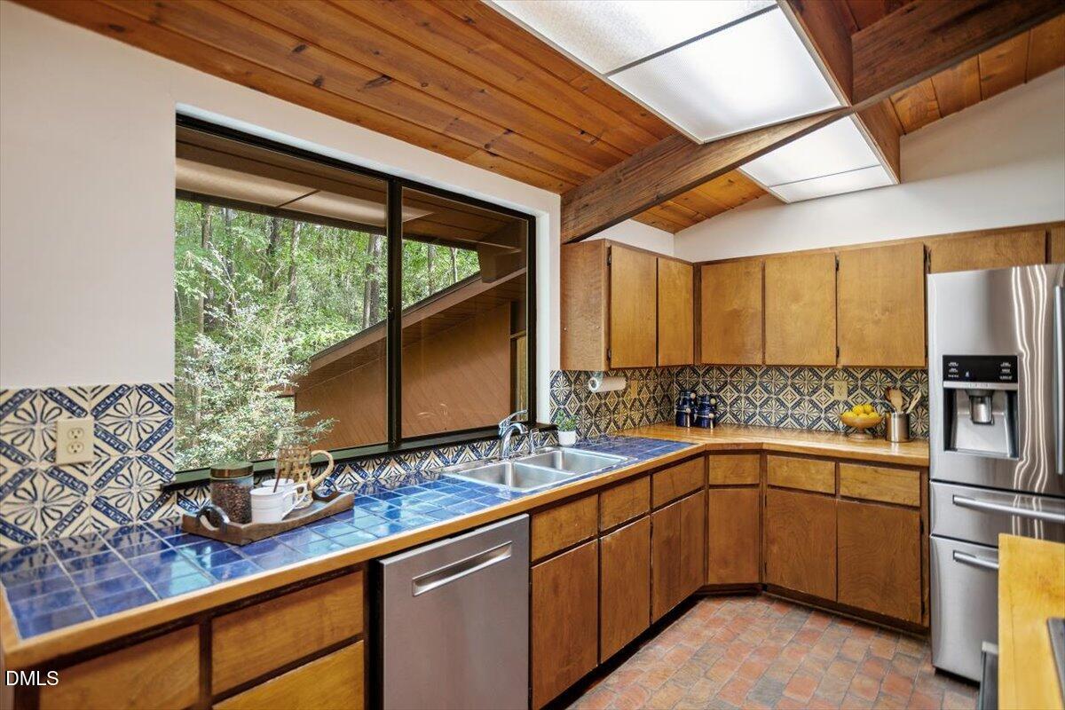 2903 Montgomery Street Durham, NC 27705 - Photo 15 of 37 a kitchen with a sink window and cabinets