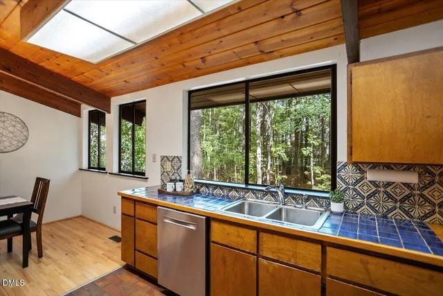 a bedroom with a large bed and a large window