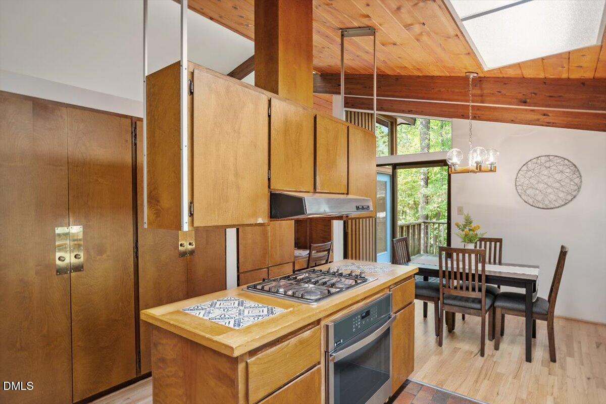 2903 Montgomery Street Durham, NC 27705 - Photo 17 of 37 a kitchen with a table chairs and a stove