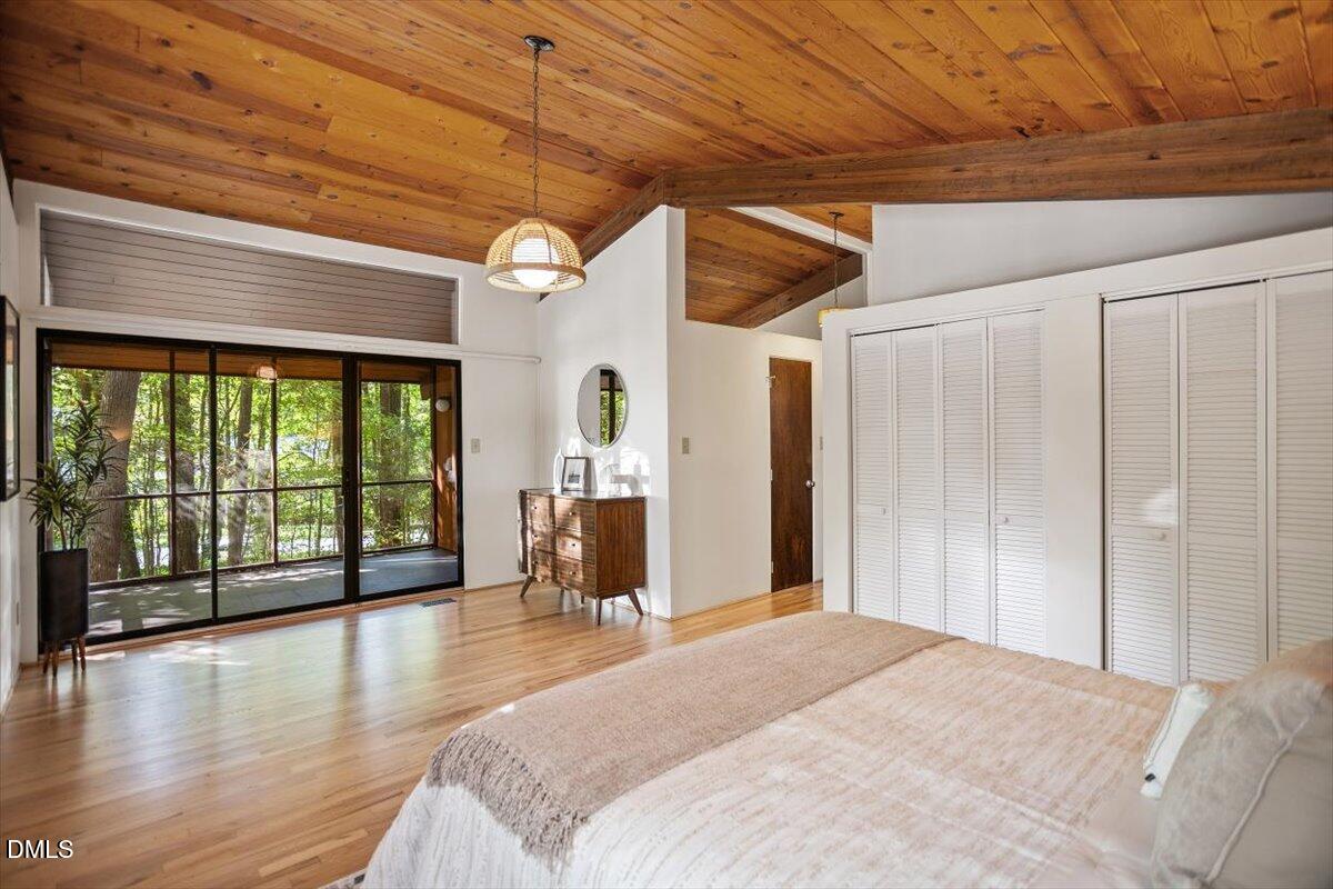 2903 Montgomery Street Durham, NC 27705 - Photo 19 of 37 a spacious bedroom with a large bed and a large window