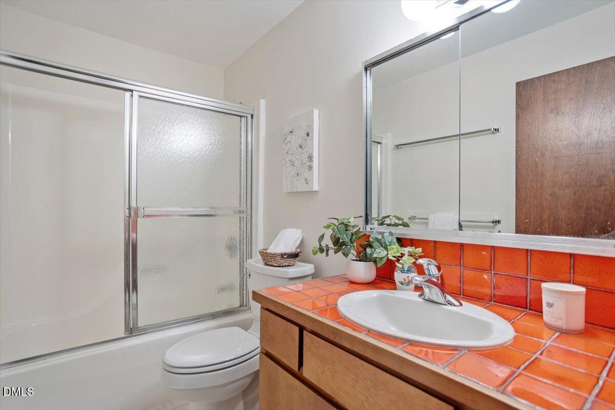 2903 Montgomery Street Durham, NC 27705 - Photo 28 of 37 a bathroom with a sink toilet and shower