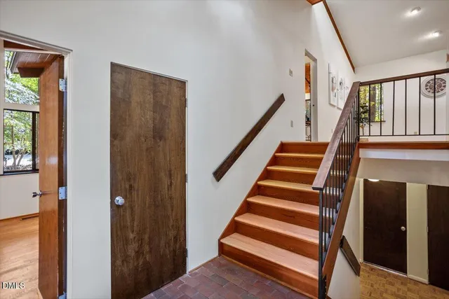 a view of a livingroom with furniture and a workspace